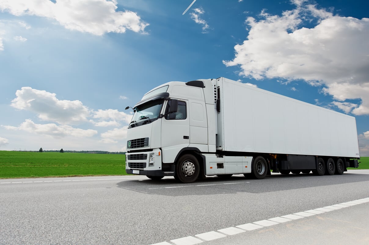 White Lorry with Trailer over Blue Sky